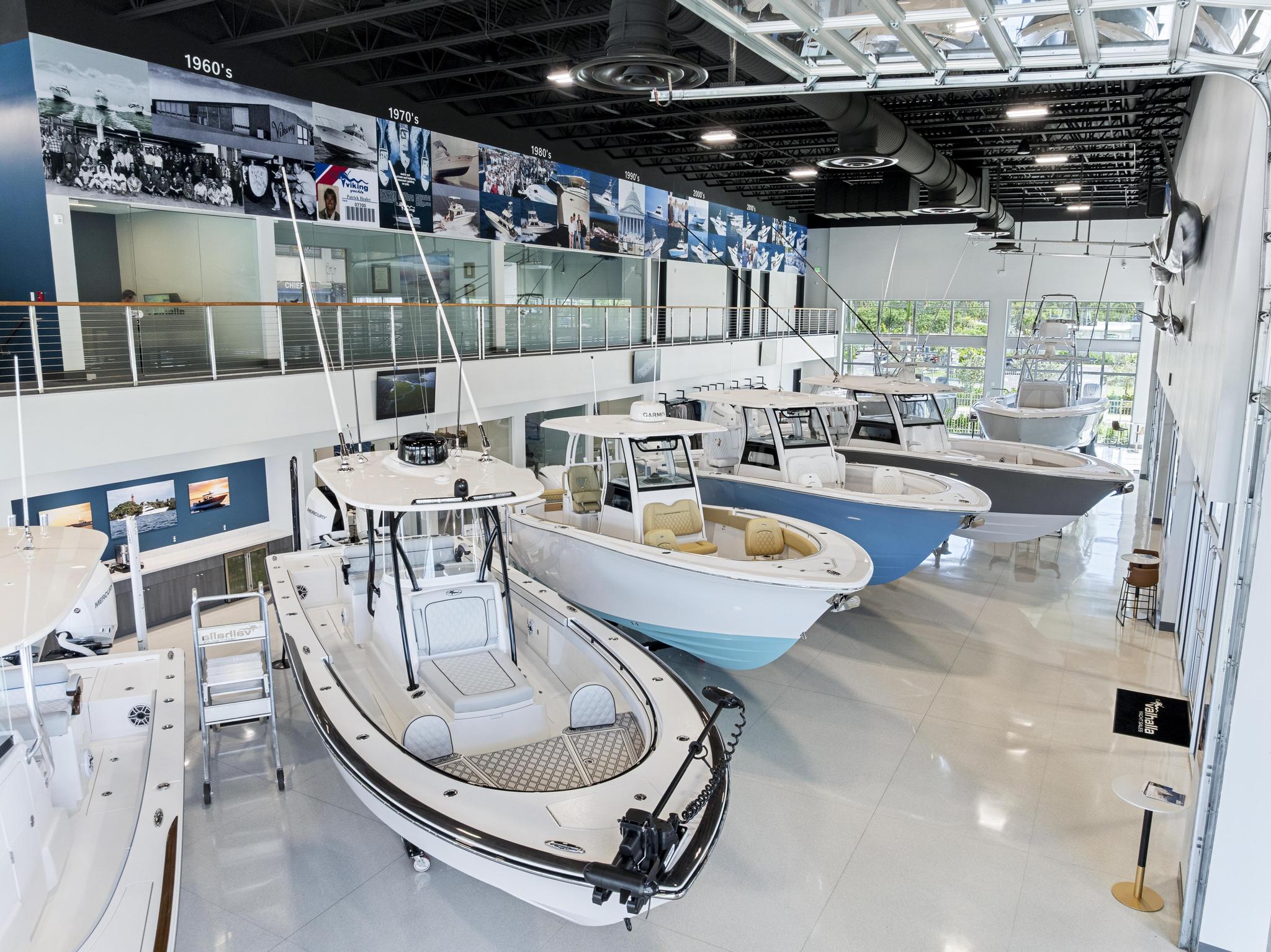Showroom interior with timeline wall and a row of center consoles